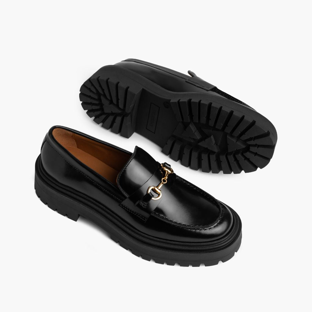 High-Traction Rubber Outsole & Lug Tread Pattern on Penny Platform Svart & Gold Läderloafers för Dam