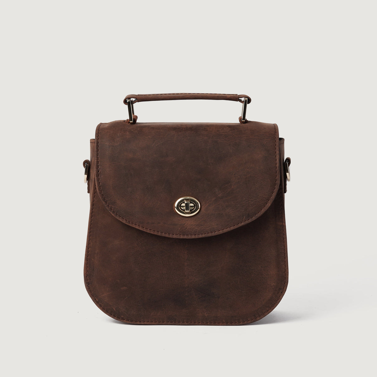 
The Sandra Vintage Distressed Brown Leather Saddle Bag For Women - Strukturerad sidoprofil med bälgdjup och volym