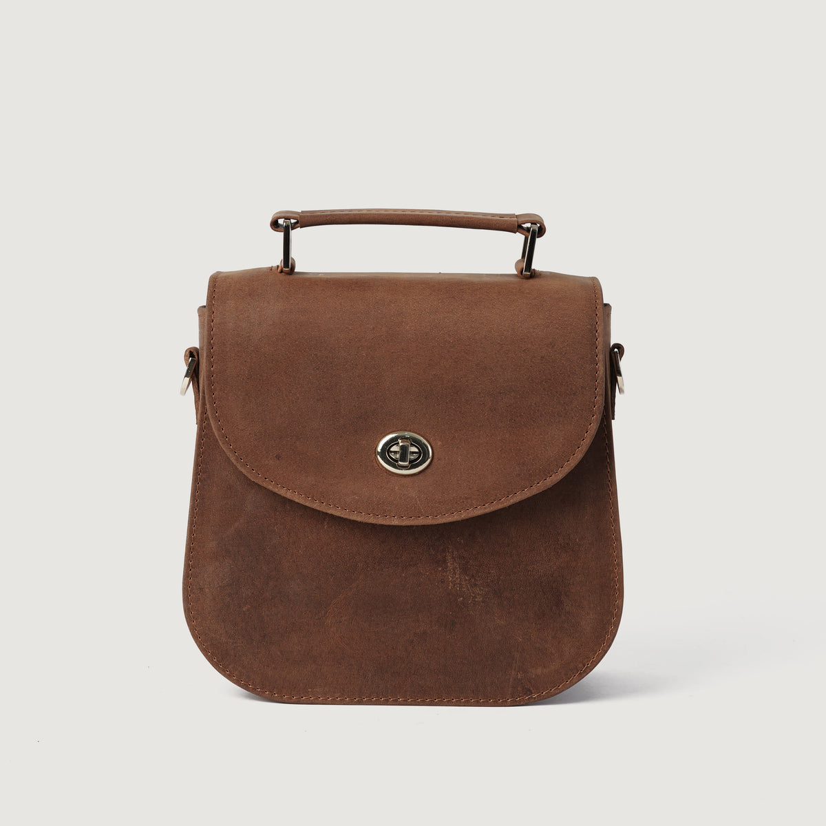 
The Sandra Vintage Ljusbrun Leather Saddle Bag For Women - Strukturerad sidoprofil med bälgdjup och volym